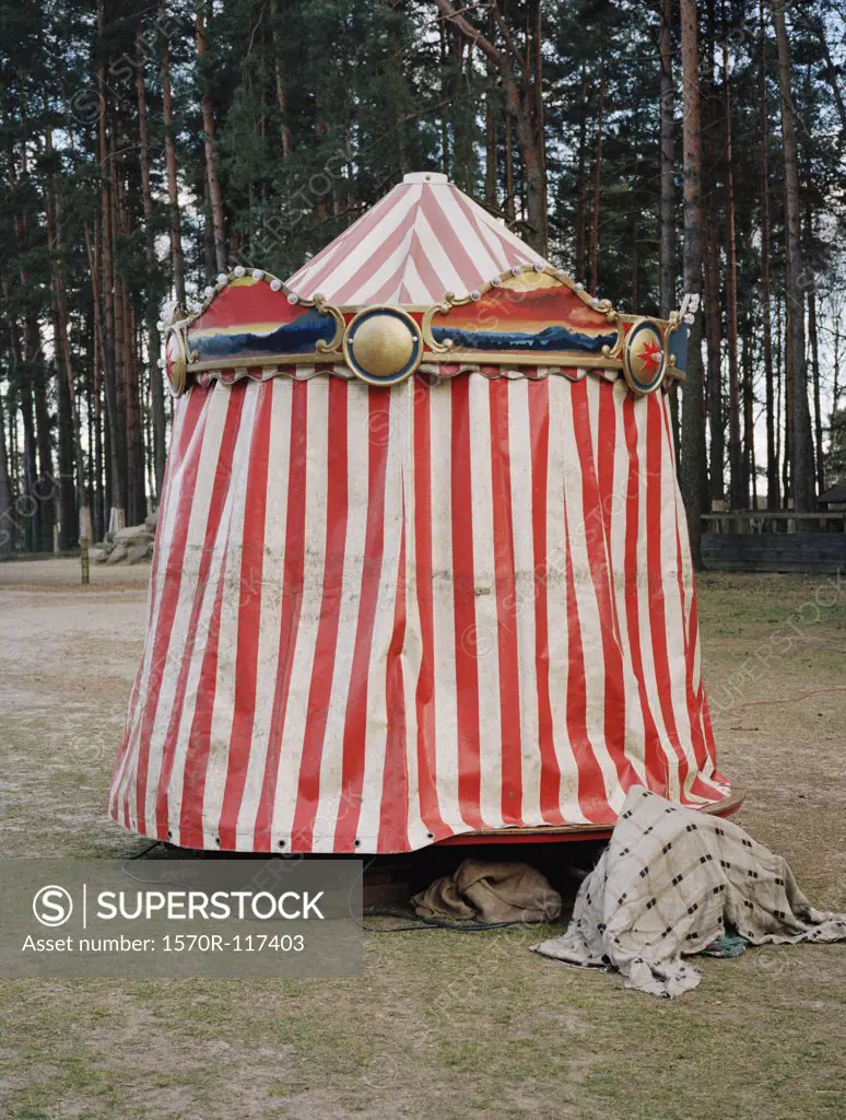 Striped tarpaulin on a miniature carousel