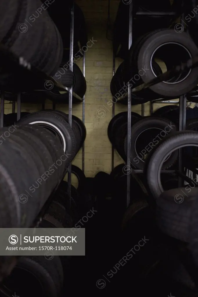 Tires stacked on shelves