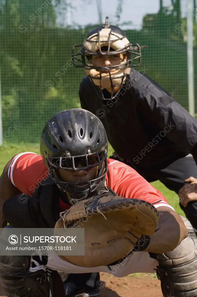 A baseball catcher and an umpire at a game