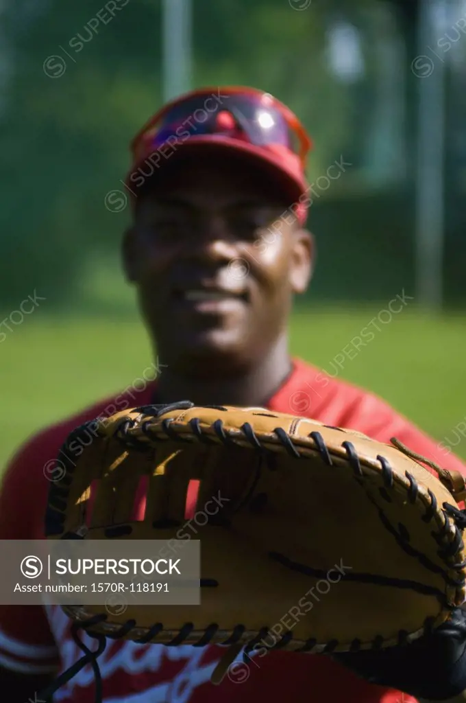 A baseball player behind a glove