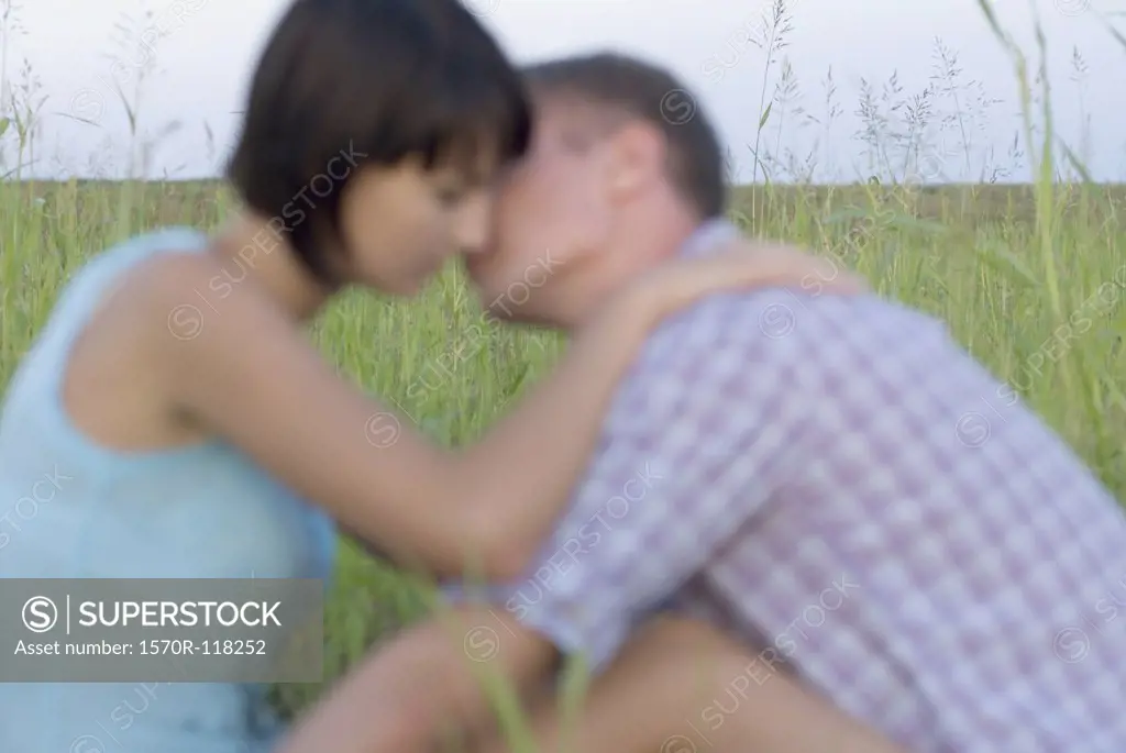 A Heterosexual couple in a field