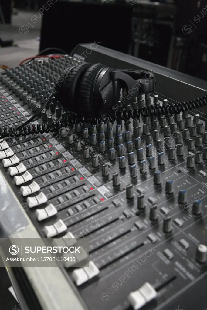 Headphones on an audio mixing board