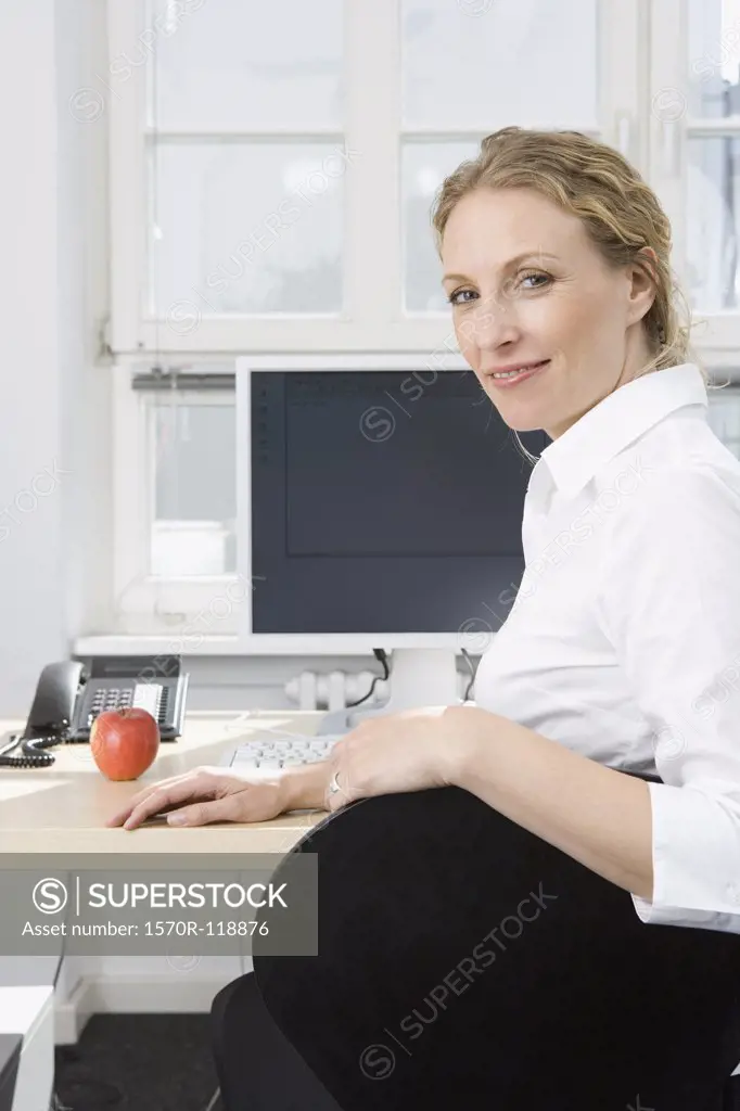 A businesswoman sitting at a desk