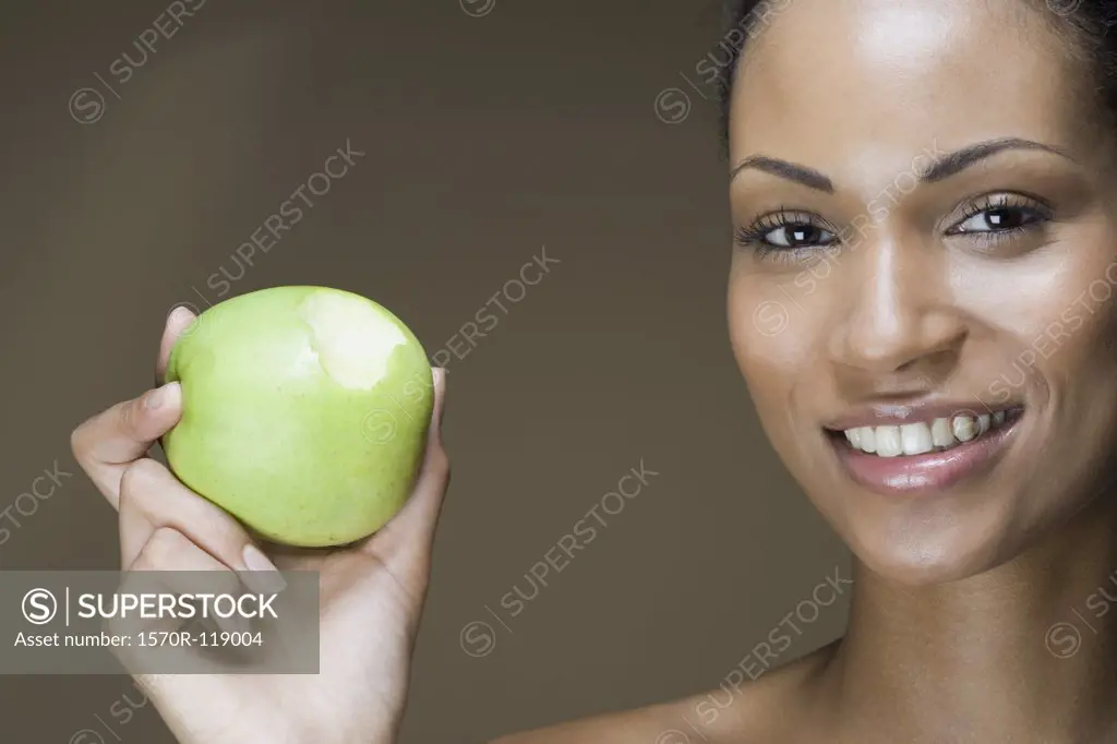 A woman eating an apple