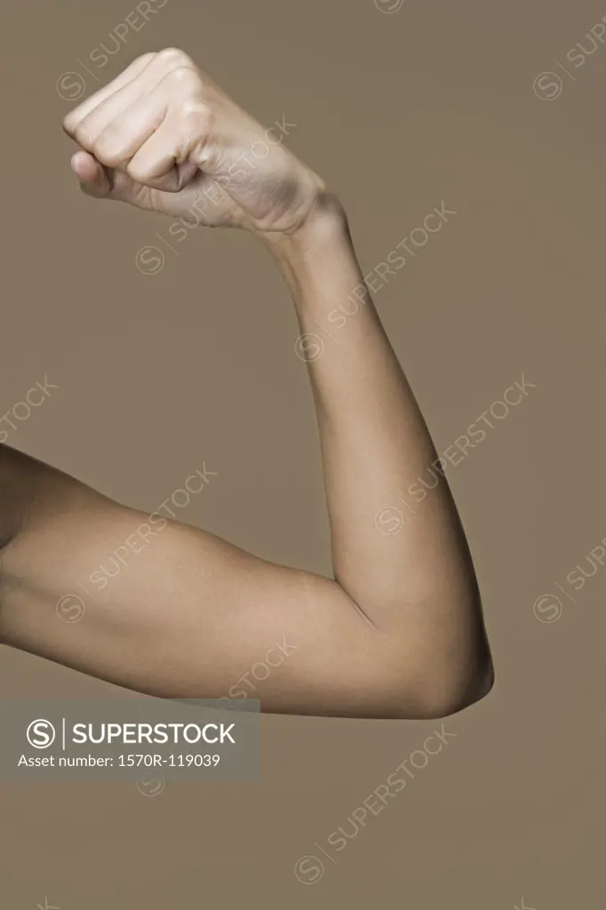 A woman flexing her bicep
