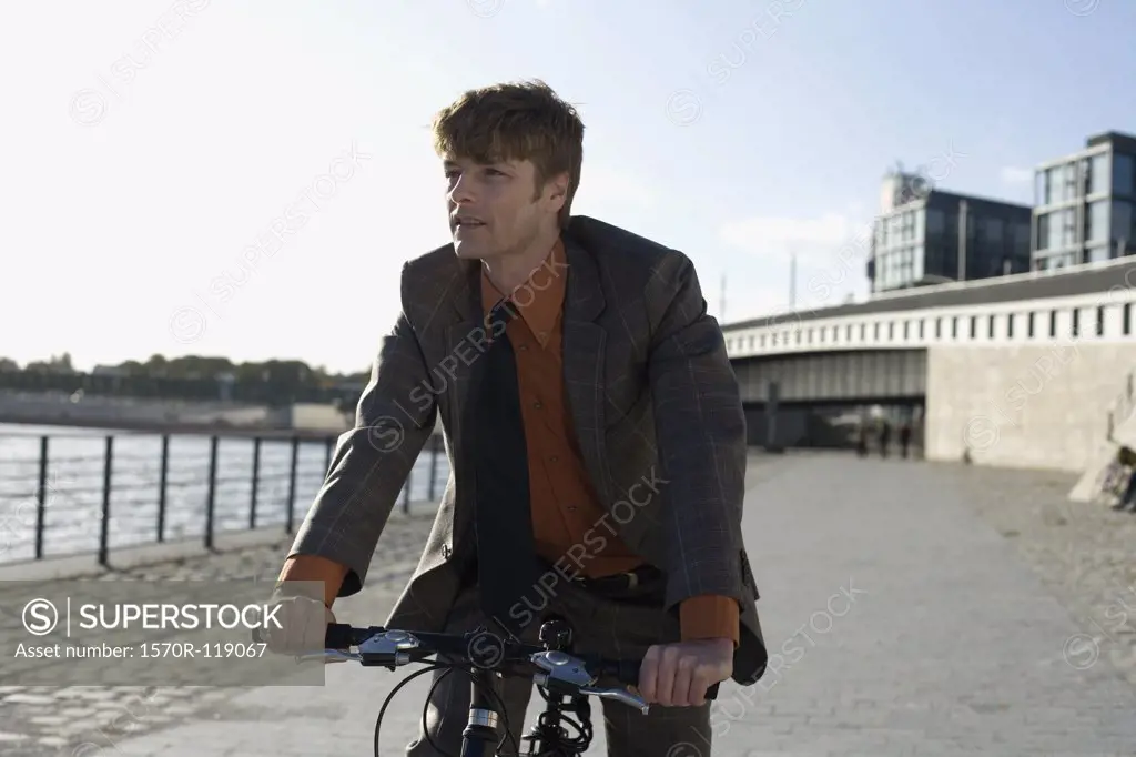 A businessman riding a bicycle