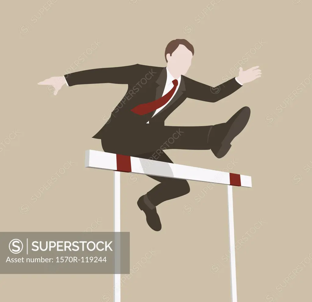 A businessman jumping over a hurdle