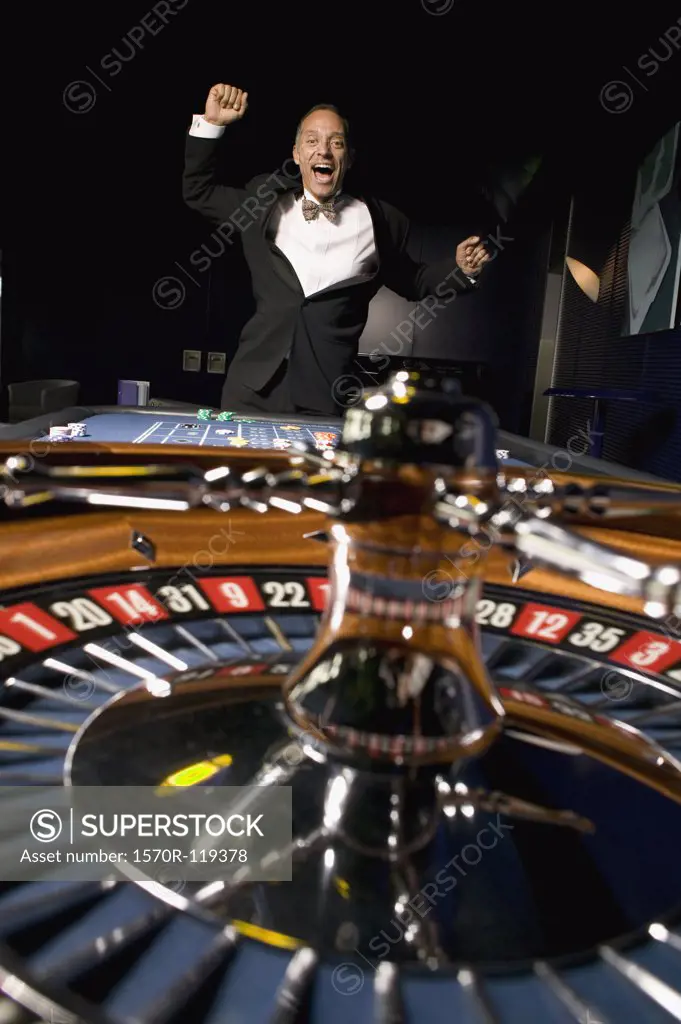 Roulette wheel with ecstatic man jumping
