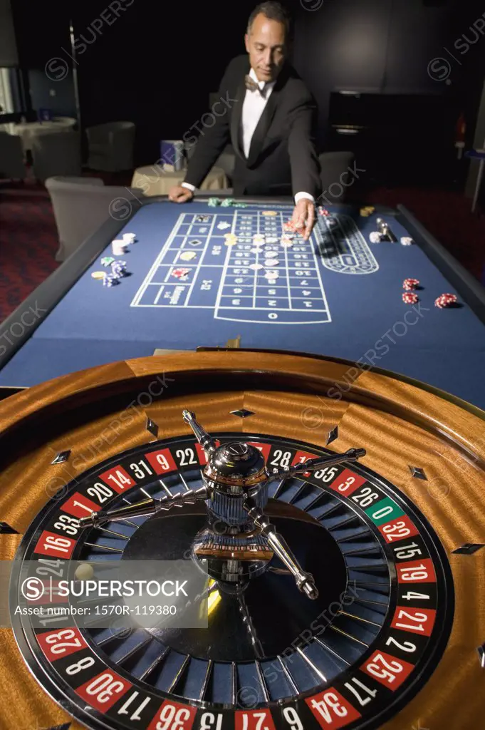 Man placing a bet at the Roulette table