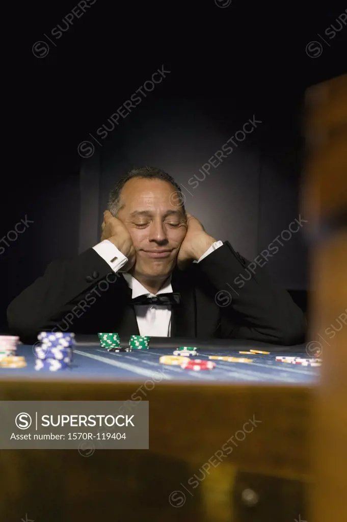 Man losing at casino table