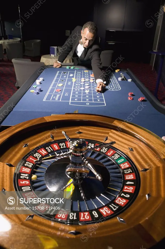 Man placing bet at the roulette table