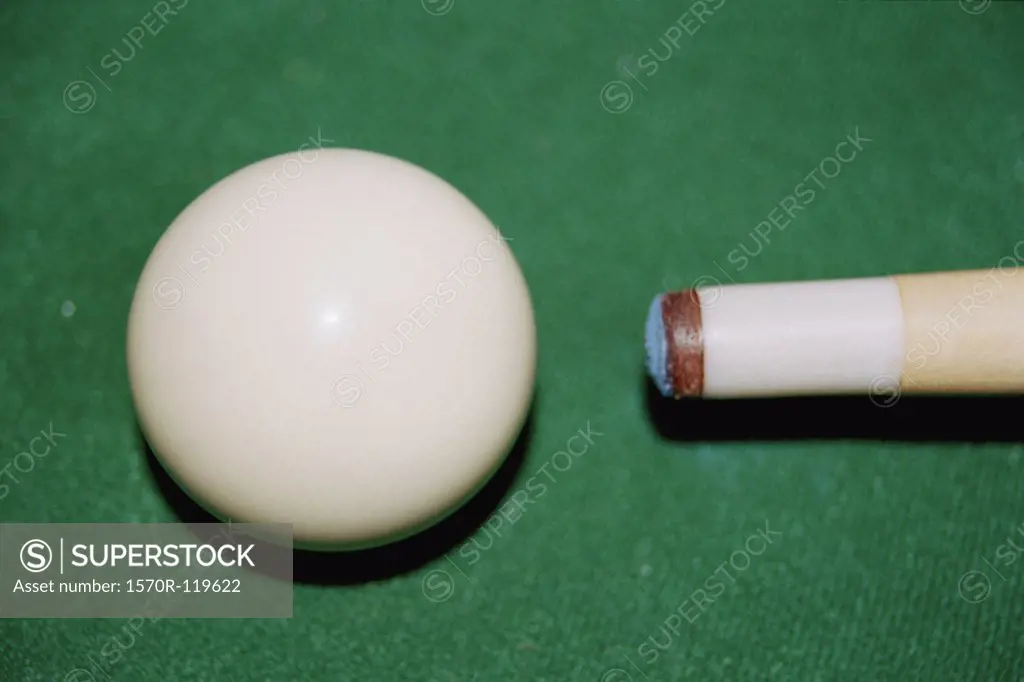 Pool cue aimed at cue ball