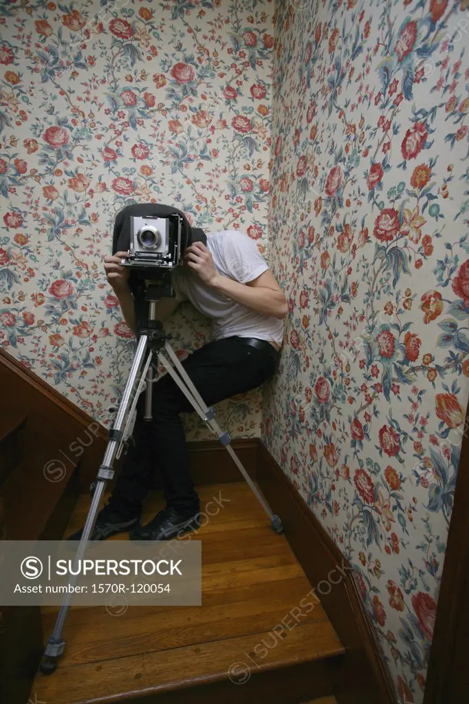 Photographer behind a camera