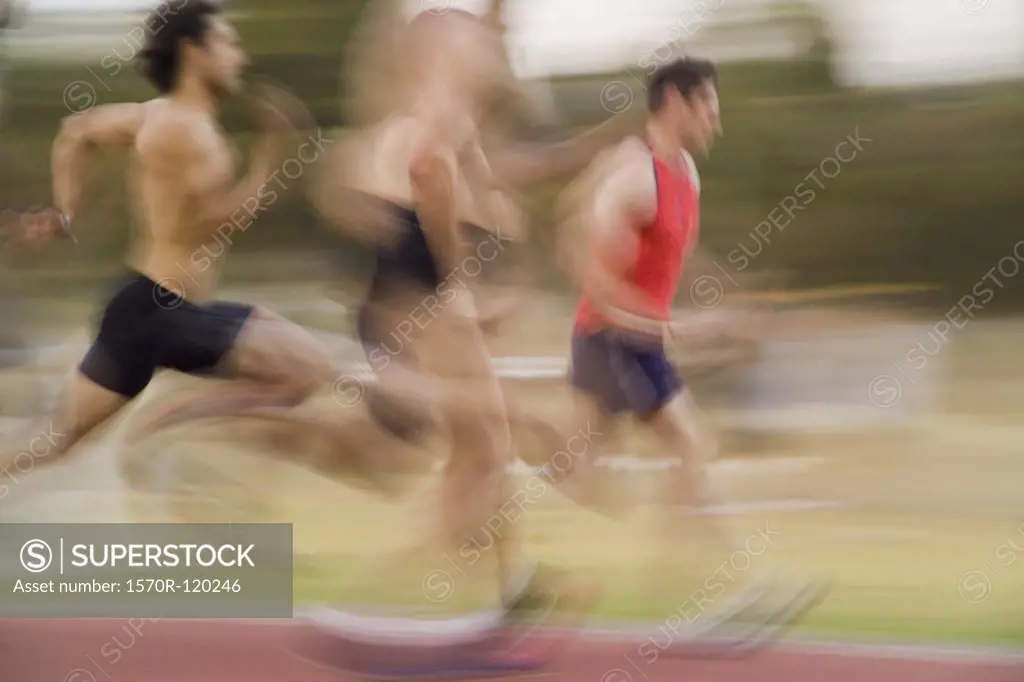 Group of athletes running on a track