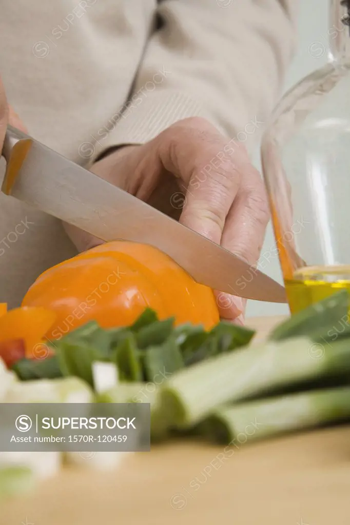 A man chopping vegetables