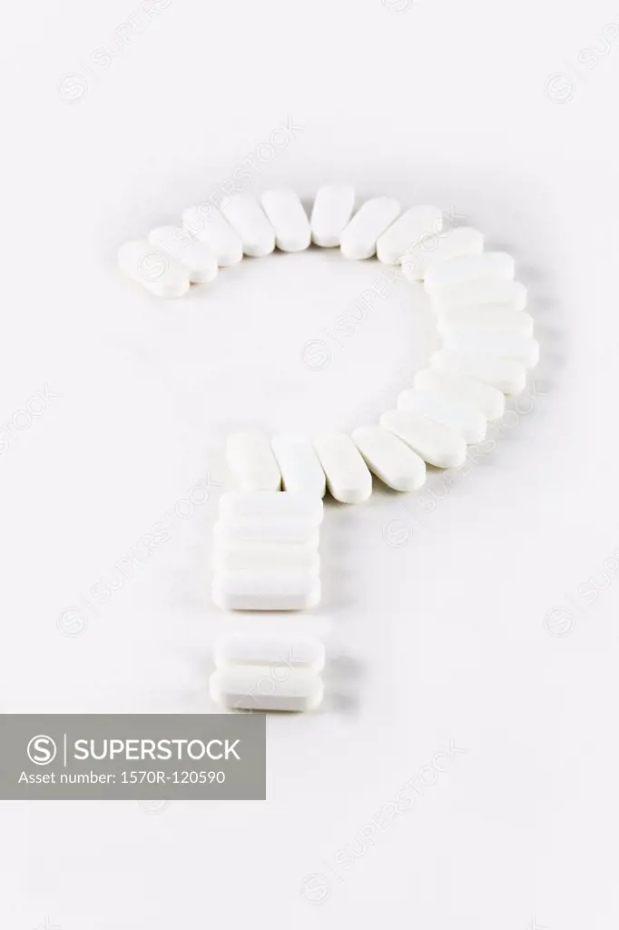 White tablets used to make a question mark