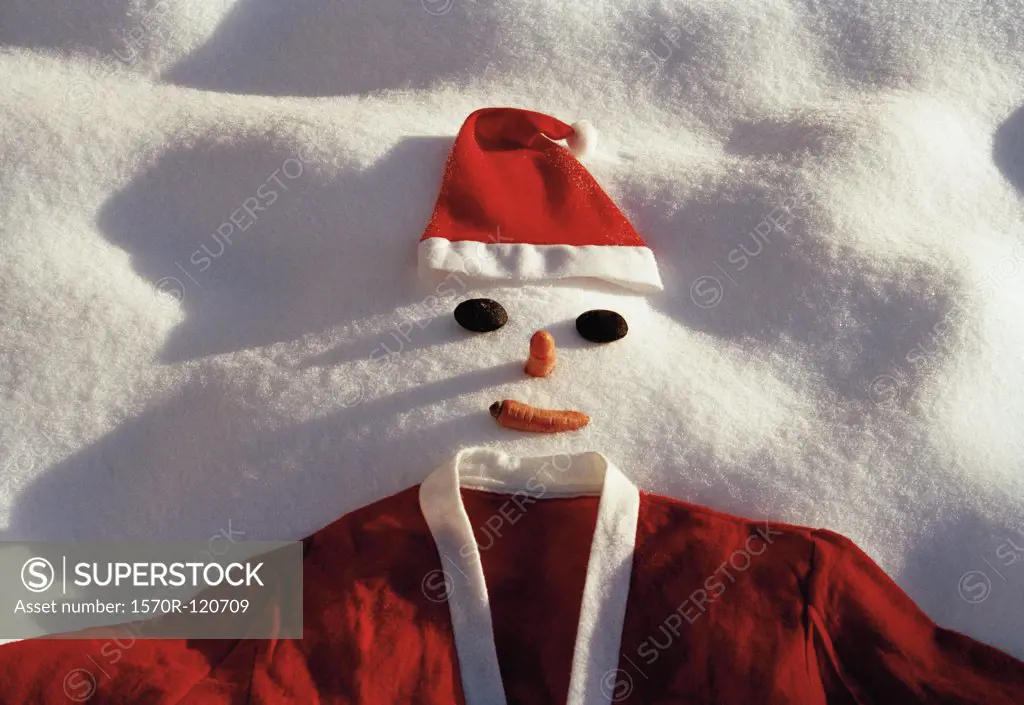 Snowman dressed up as Santa Claus in the snow