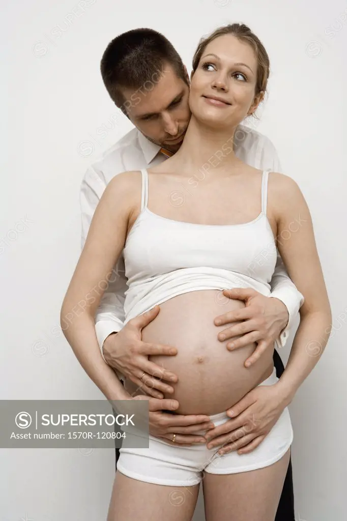 Pregnant couple embracing