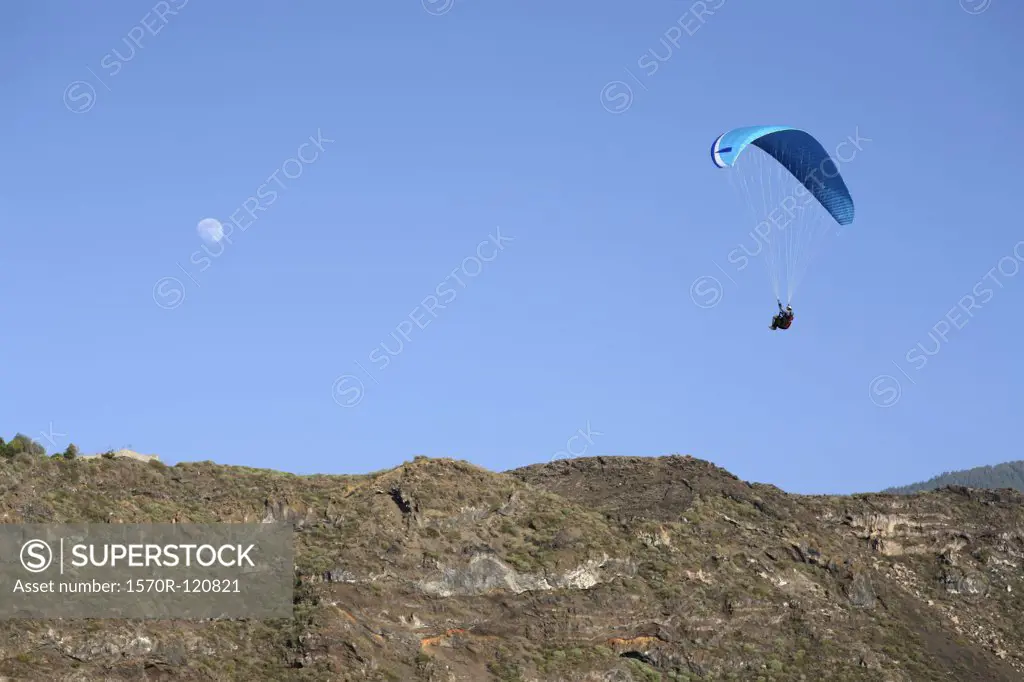 A paraglider in the sky