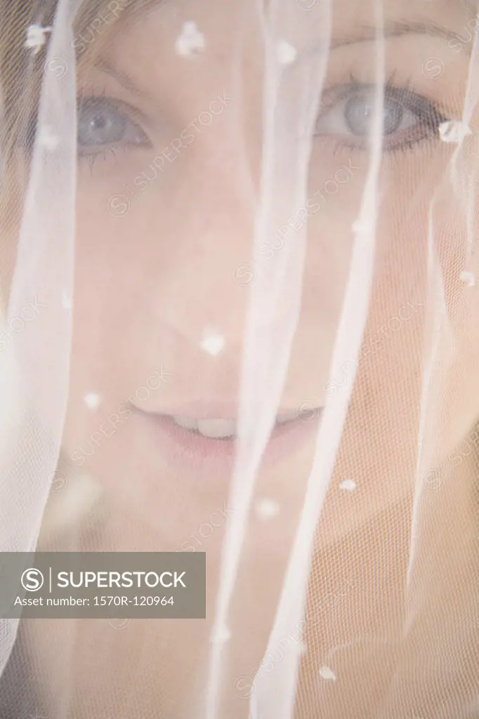 Close-up of a bride under a veil