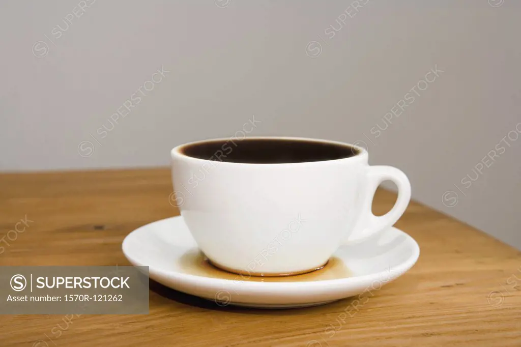 An overflowing coffee cup