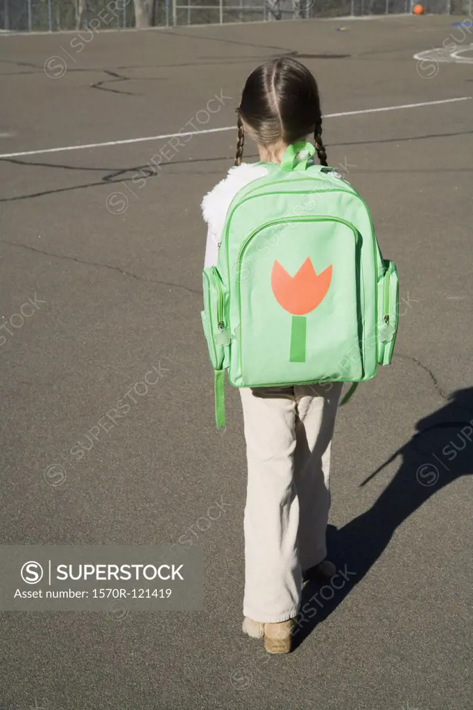 Rear view of a girl with a rucksack