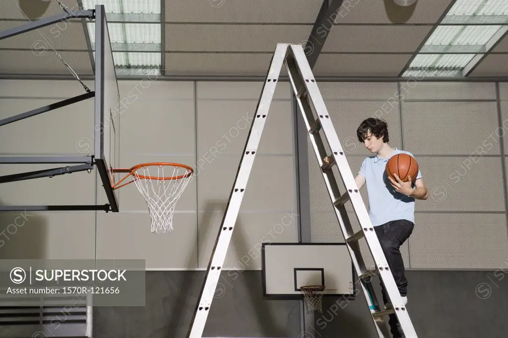 A man climbing up a ladder next to a basketball hoop