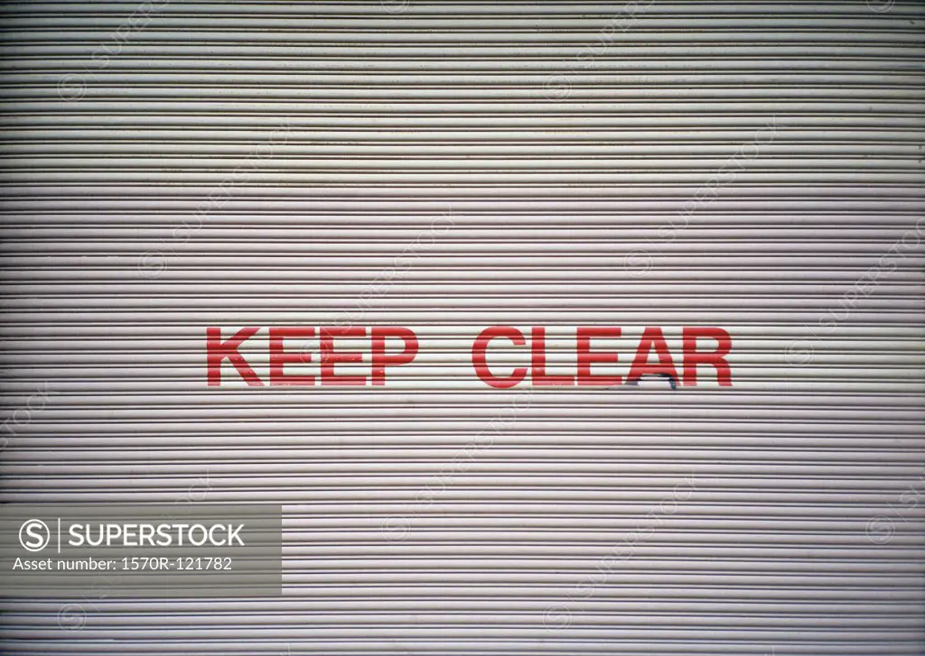 Keep Clear sign on a garage door