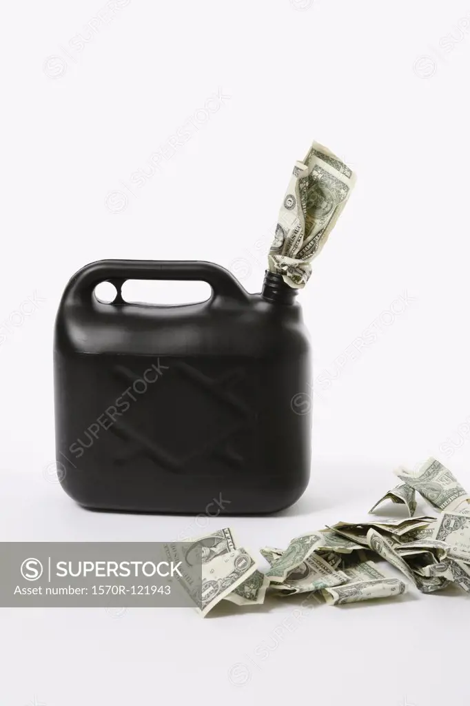 A petrol can with dollar bills