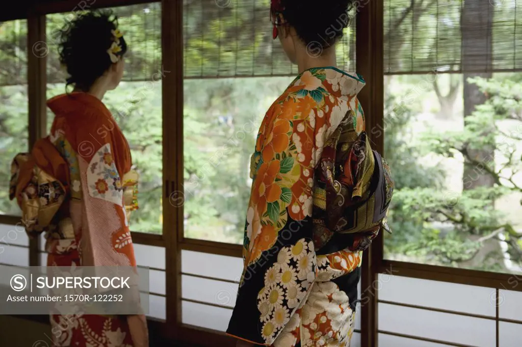 Two women wearing kimonos
