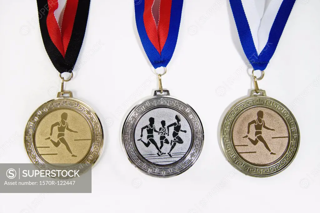 Studio shot of a gold medal, silver medal and a bronze medal