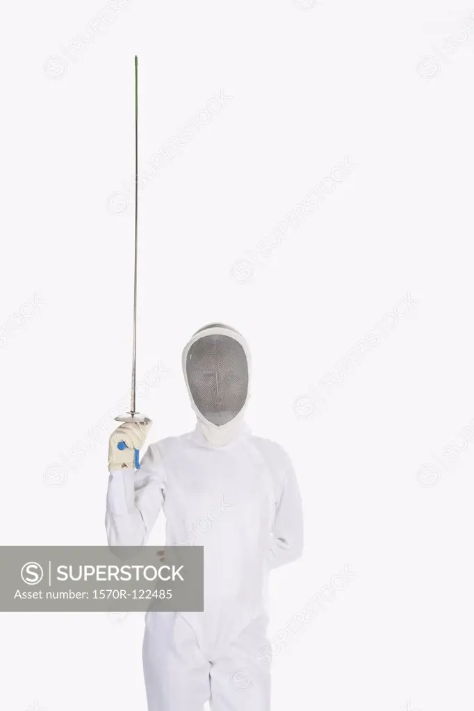 Studio shot of female fencer posing with a fencing foil