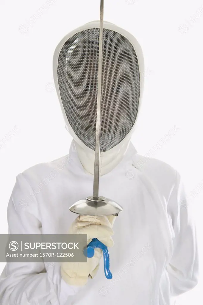 Studio shot of female fencer posing with a fencing foil