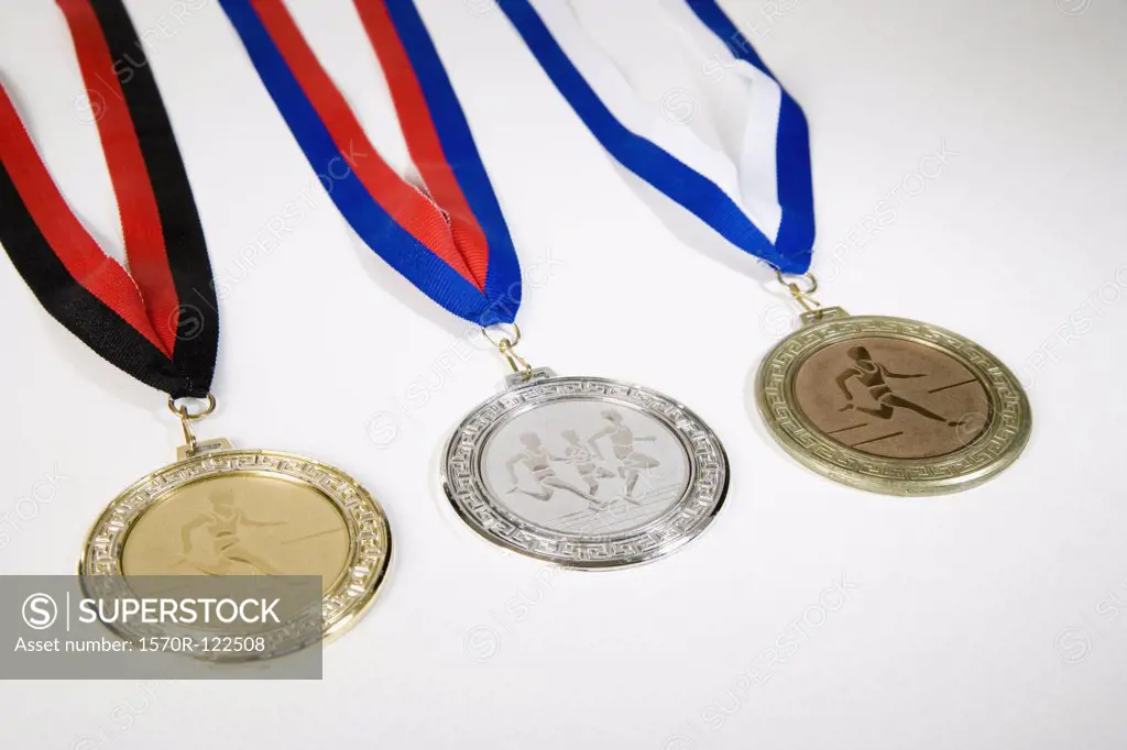 Studio shot of a gold medal, silver medal and a bronze medal