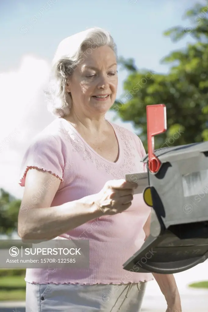 A senior woman checking the mailbox