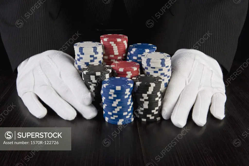 A croupier with gambling chips