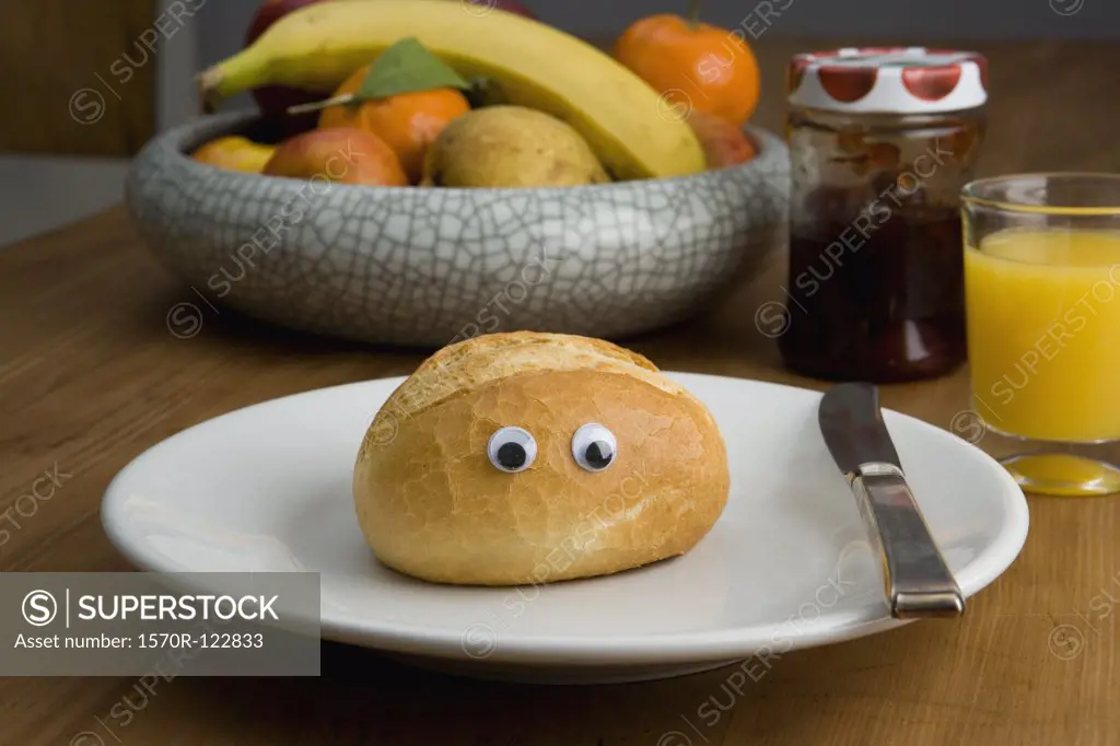 A bread bun with eyeballs for breakfast