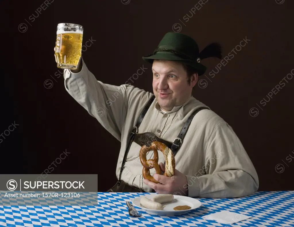 Stereotypical German man, smiling and raising a beer