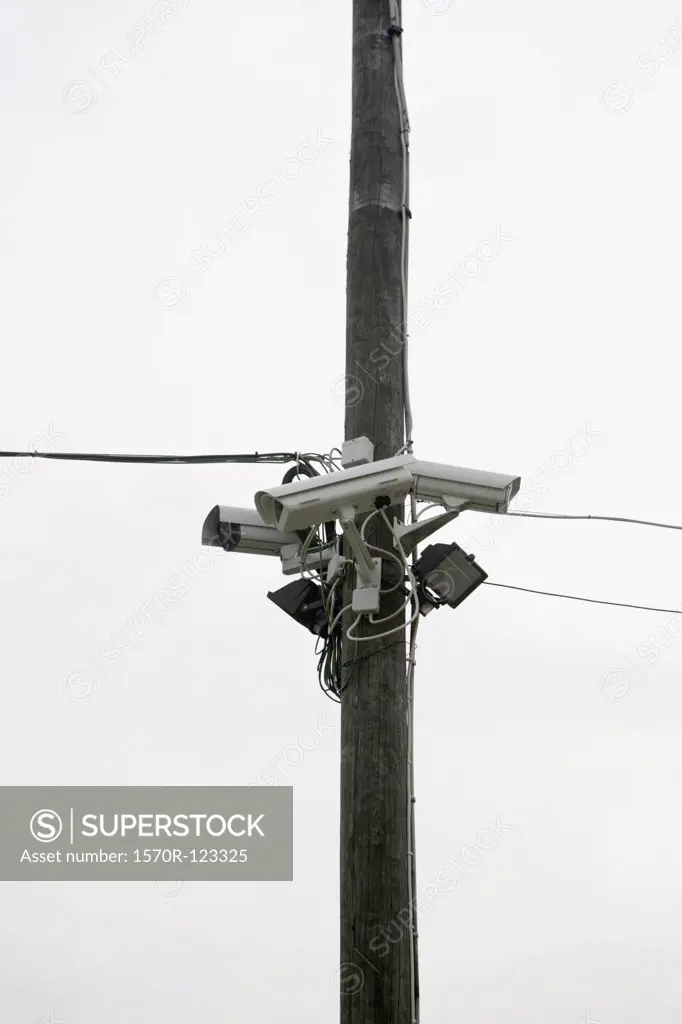 Three Security Cameras posted on a utility pole