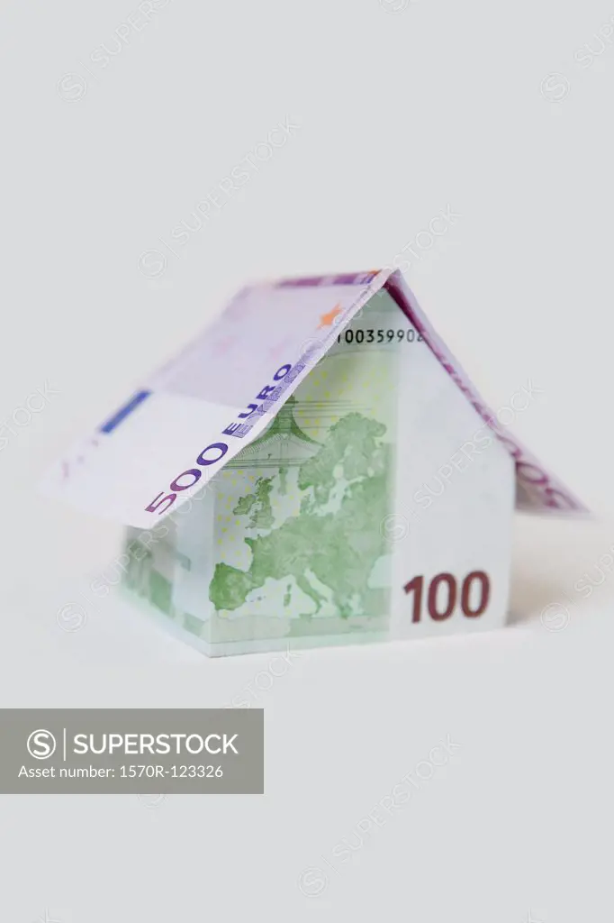 A Five Hundred Euro Banknote and a Hundred Euro Banknote folded to look like a house