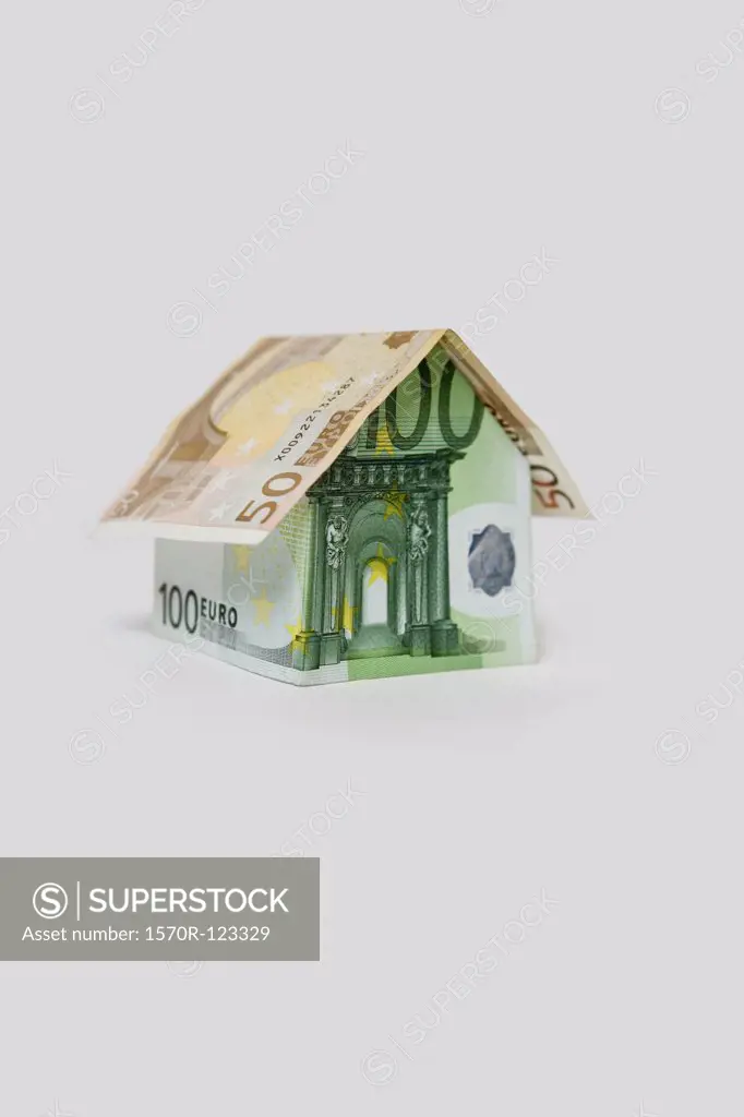A Fifty Euro Banknote and a Hundred Euro Banknote folded to look like a house