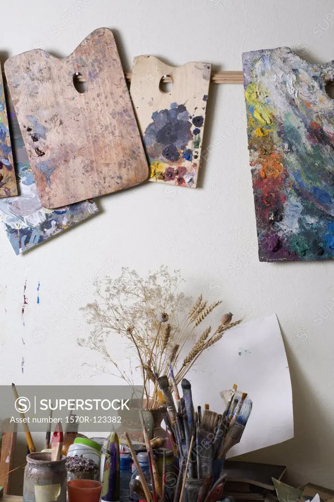 An artist's palettes and paintbrushes