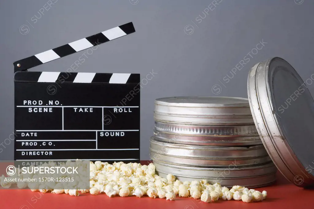 Clapperboard, popcorn and film reels