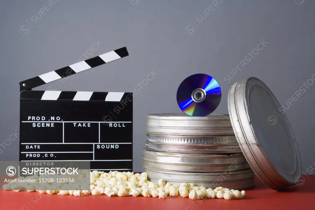 Clapperboard, popcorn, film reels and CD
