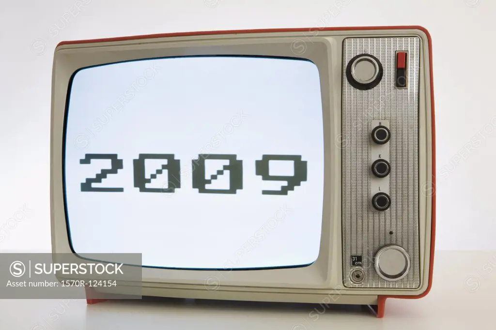 A television with a black and white image of '2009'