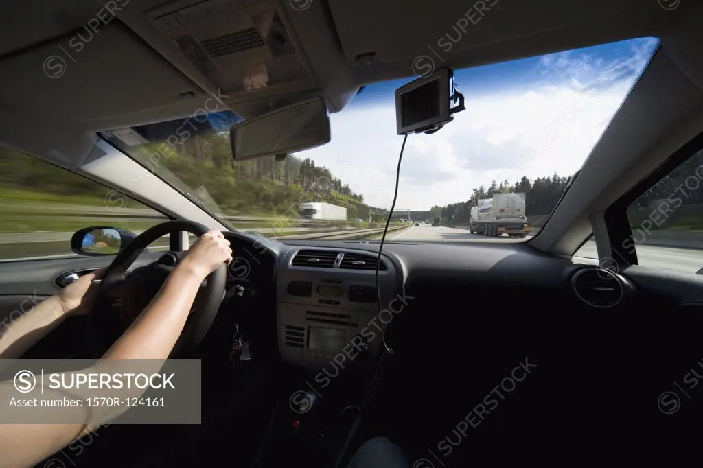 A person driving a car on a highway in Bavaria, Germany