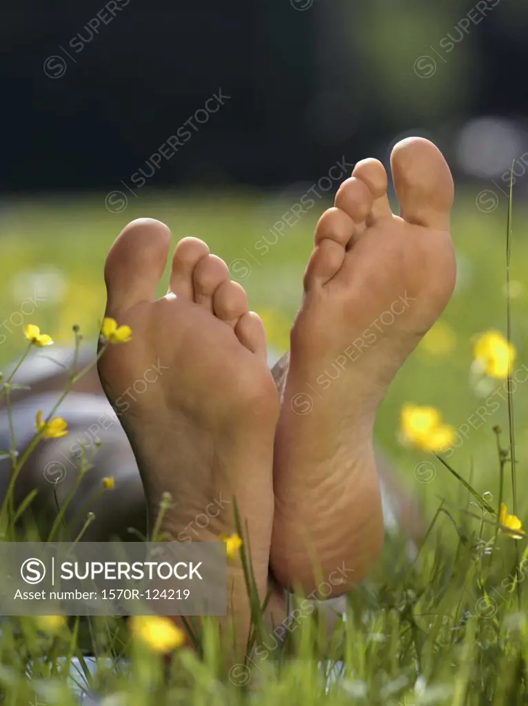The soles of a person's bare feet, close up