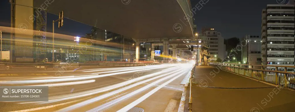 Traffic passing on a road at night, Tokyo, Japan