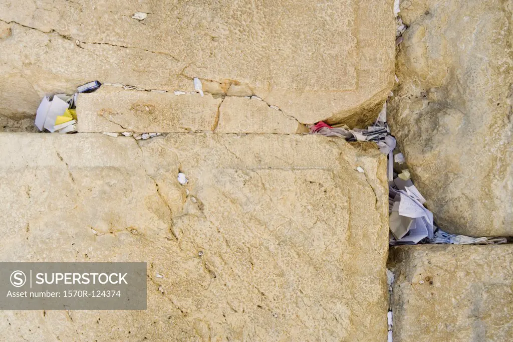 Slips of paper with prayers on them in the crevices of the Wailing Wall, Jerusalem
