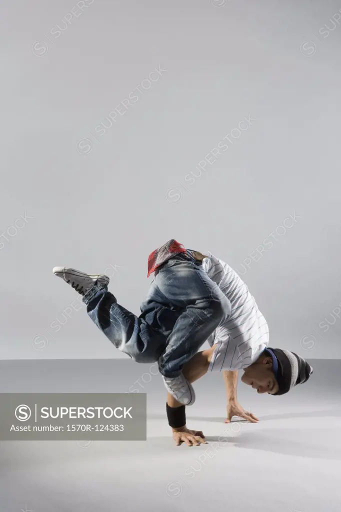 A B-boy doing a Freeze breakdance move